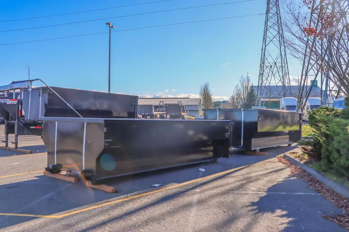 Roll-off dumpster ready for waste disposal at job site for Concrete Dumpster Rental in Winder